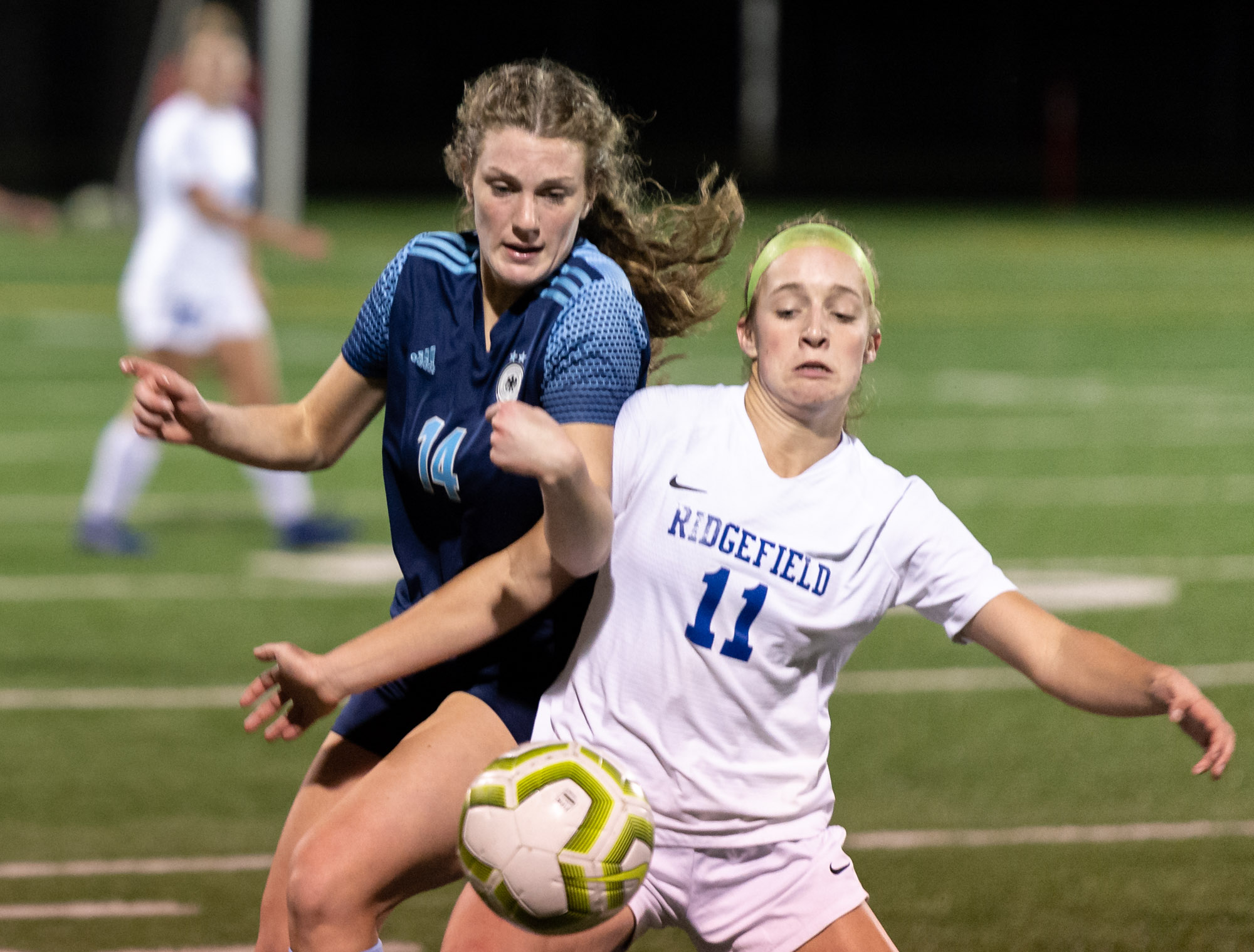 Hockinson's Molly Ramanchock and Ridgefield's Claire Jones fight for the ball in the 2A District Girls Soccer Championship on Thursday, Nov. 4, 2021, at District Stadium in Battle Ground.