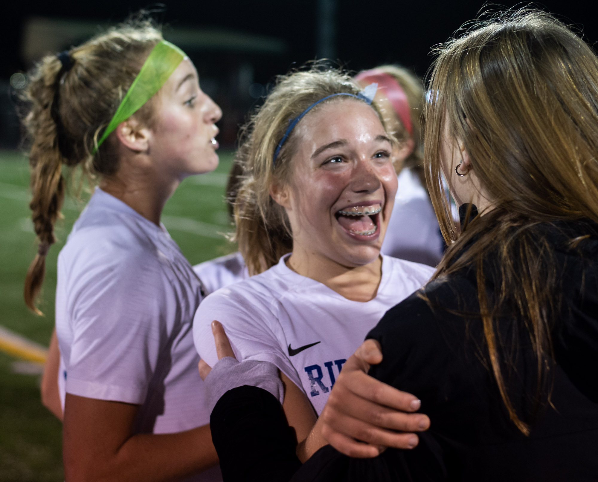 Ridgefield's Ava Kruckenberg hugs a teammate in the 2A District Girls Soccer Championship on Thursday, Nov. 4, 2021, at District Stadium in Battle Ground.