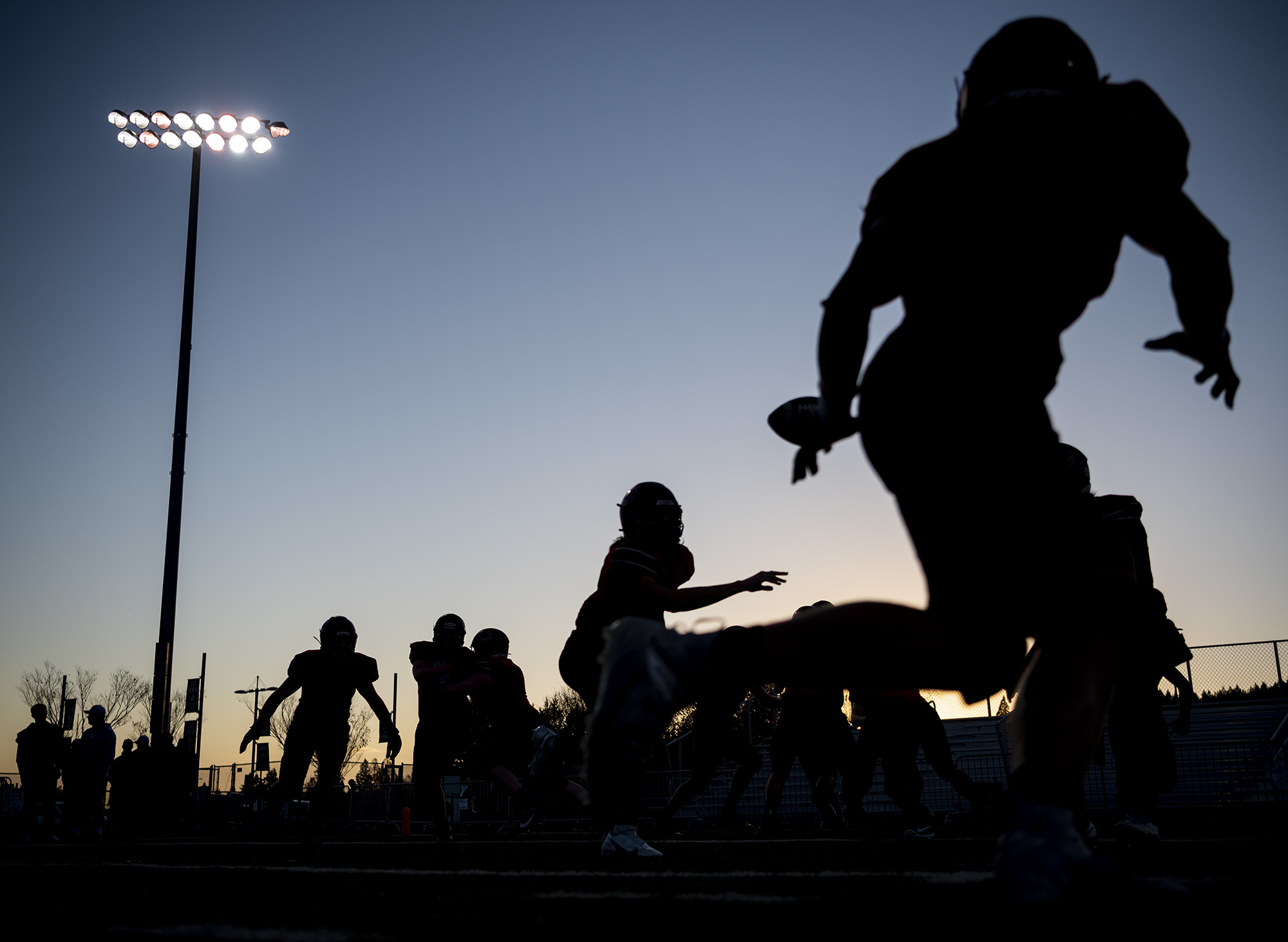 Camas football players warm up Friday, Nov. 5, 2021, before the Papermakers’ game against Mount Rainier at Doc Harris Stadium.