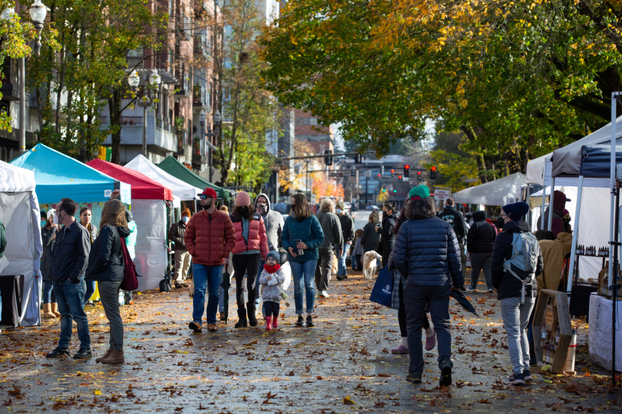 People stroll through the Vancouver Farmers Market on Saturday. This weekend kicked off the fall market with about 20 new vendors.