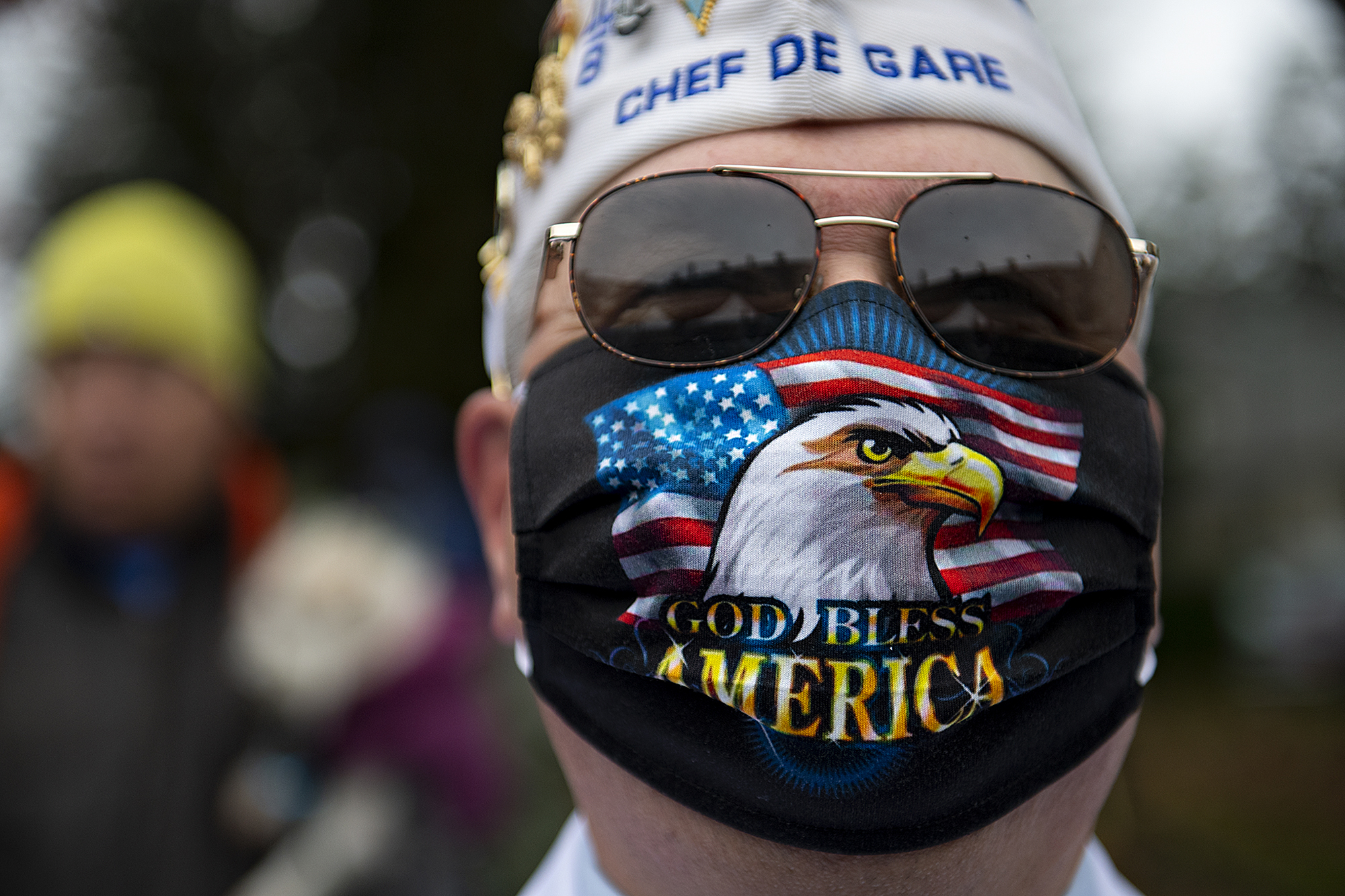 Chef De Gare Cliff Taylor shows his patriotism through his face mask while participating in the Veterans Day Ceremony at the Fort Vancouver Artillery Barracks on Thursday afternoon, Nov. 11, 2021.