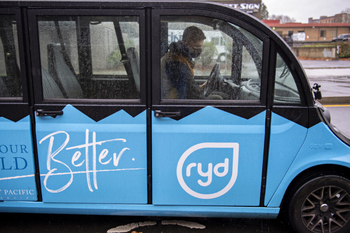 Cole Wyckoff, one of the owners of RYD, pauses to pick up a passenger Monday. The service has expanded to anyone who needs a lift in downtown Vancouver.
