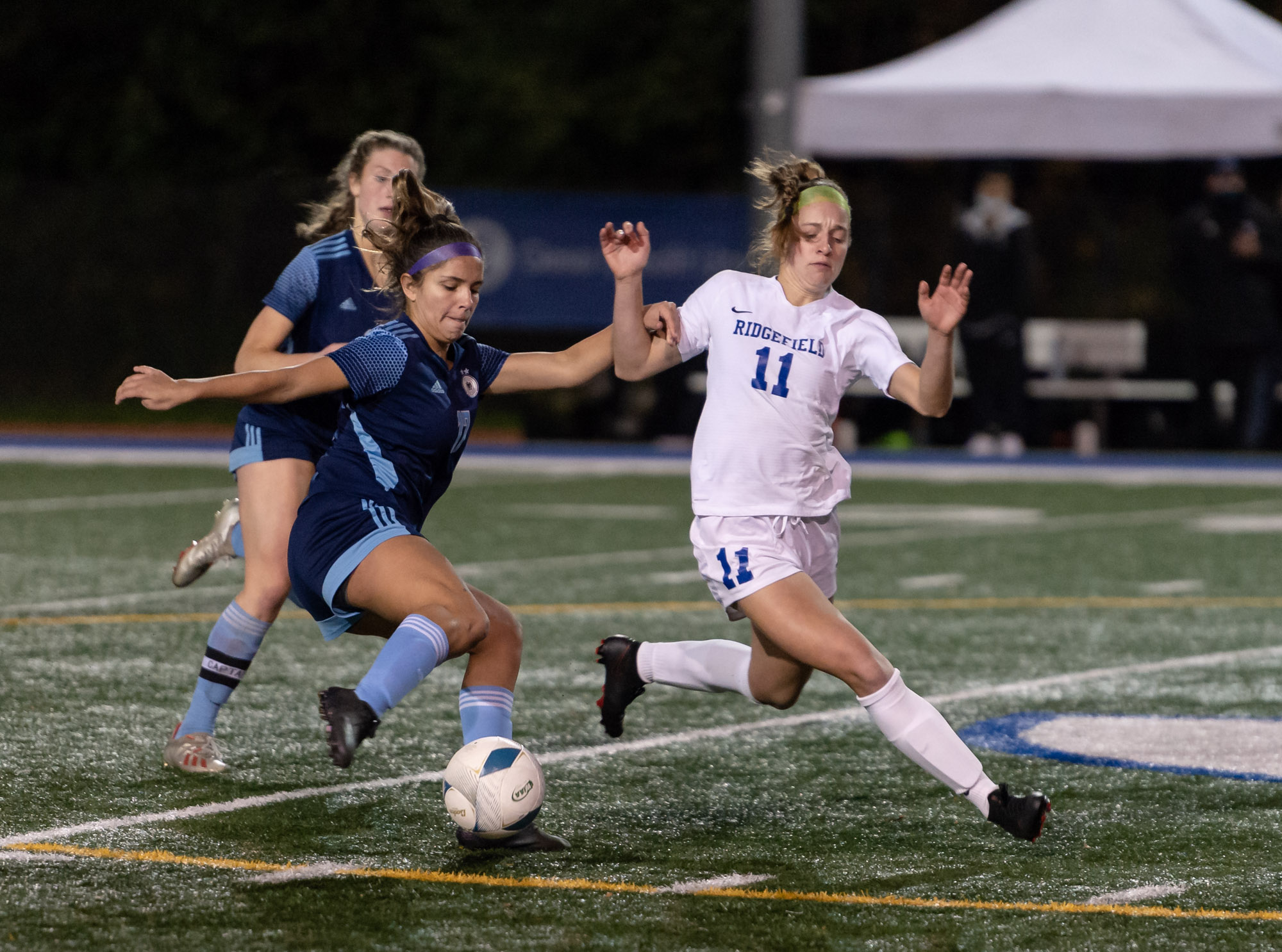Hockinson's Abby Dombrow holds off Ridgefield's Claire Jones in a 2A State soccer semifinal on Friday, Nov. 19, 2021, at Shoreline Stadium.