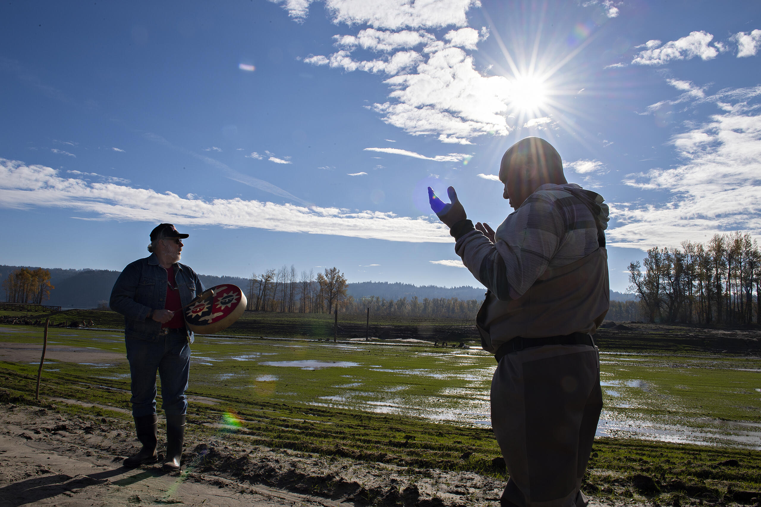 Sam Robinson, Chinook Indian Tribe vice chairman, left, performs the song "The Changer", which honors upcoming change, while joined by Alvey Seeyouma, a member of the Hopi Tribe working with the Lower Columbia Estuary Partnership, before the wapato planting at Steigerwald Lake National Wildlife Refuge on Monday afternoon, Nov. 22, 2021.