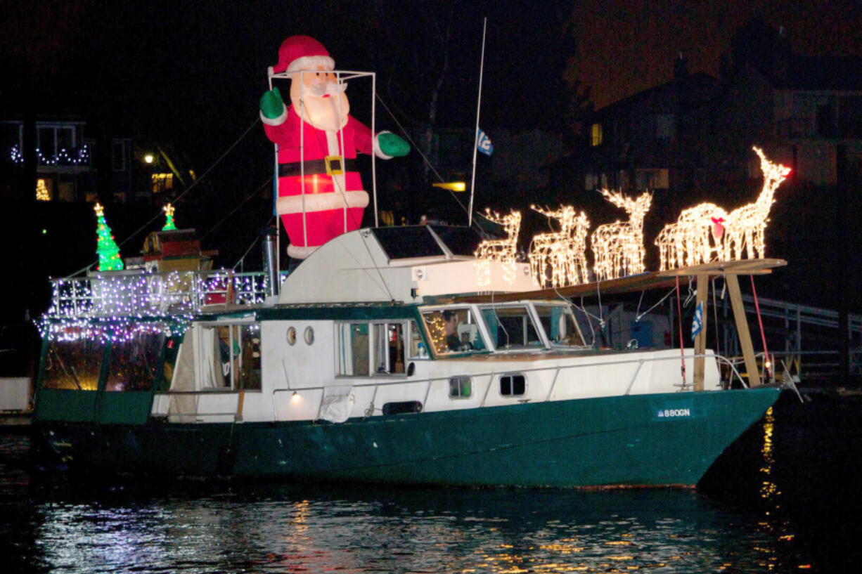 Contributed by Christmas Ships 
 Santa drives his reindeer along the Columbia River as part of the annual Christmas Ships parade, which returns this month. (Contributed by Christmas Ships)