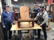 Jeff Chandler, Ken Leffel, Jim Pearson and Doug Corso build Adirondack chairs to raise funds for Friends of the Carpenter.