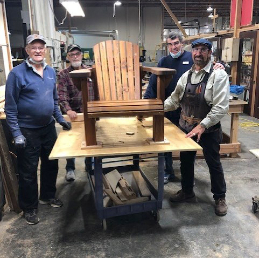 Jeff Chandler, Ken Leffel, Jim Pearson and Doug Corso build Adirondack chairs to raise funds for Friends of the Carpenter.