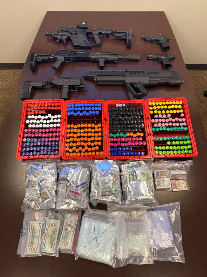 Investigators recovered six firearms; $32,000 in cash; about 11,000 counterfeit oxycodone pills they said likely contained fentanyl, worth an estimated $110,000; and steroids and other pills packaged for distribution, worth an estimated $35,000, during a search of a house at 8313 N.E. 158th Ave. They searched the house in connection with the May overdose death of a man in east Clark County.