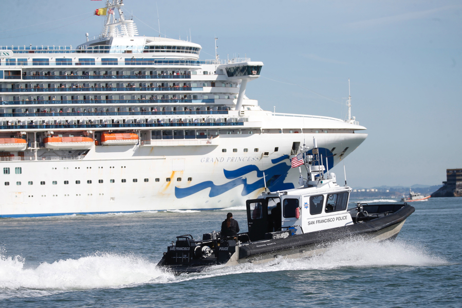 San Francisco police escort the coronavirus-stricken Grand Princess on its way to dock at the Port of Oakland on March 9, 2020.
