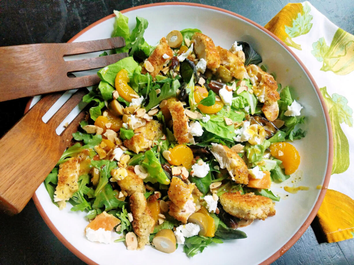 This warm arugula salad delivers a satisfying mix of pan-fried chicken tenders, fresh orange, olives and goat cheese in a warm citrus dressing, with a toasted almond garnish for crunch.