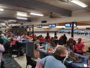 High school bowlers occupy every lane at Hazel Dell Lanes on Monday as the prep girls bowling season opened.
