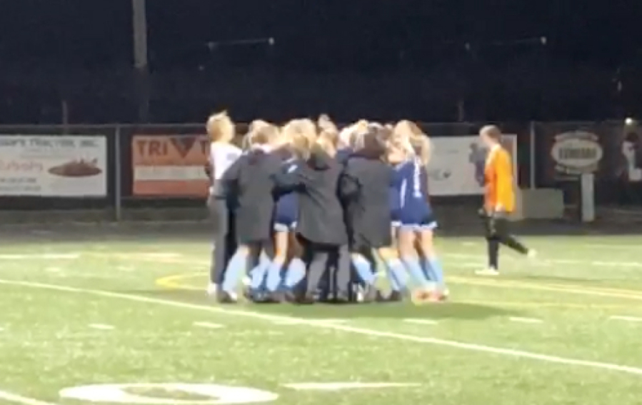 The Hockinson girls soccer team celebrates after beating Sehome in a penalty kick shootout in the first round of the Class 2A state playoffs on Wednesday in Battle Ground.