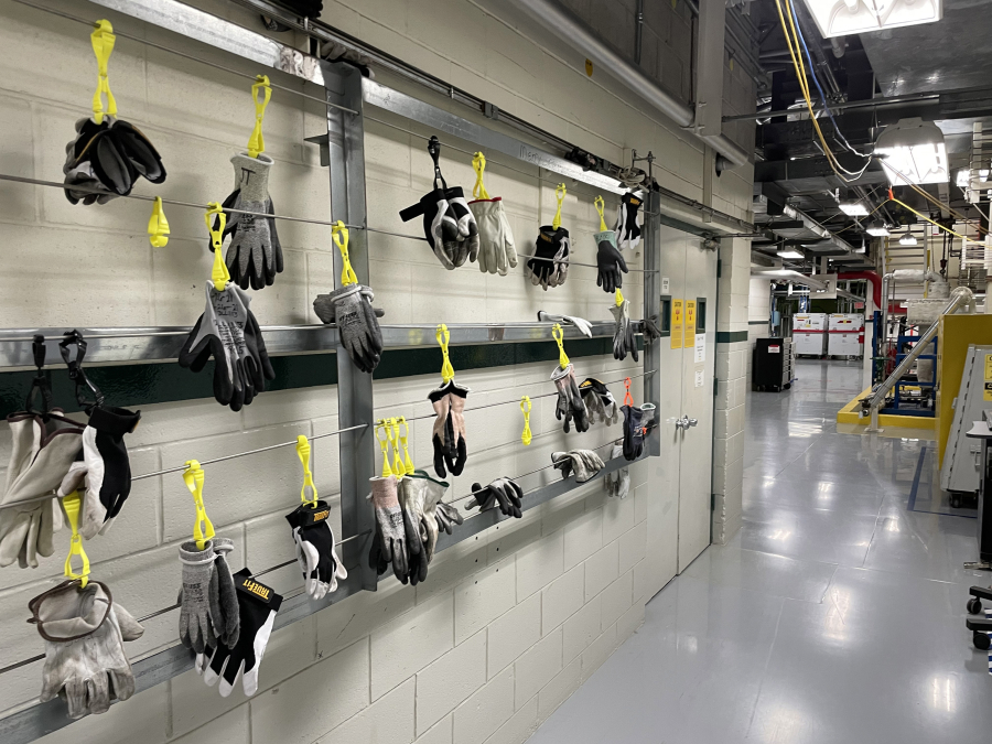Protective gloves for workers hang in hallway at the Columbia Generating Station in Benton County, Washington, in June 2021.