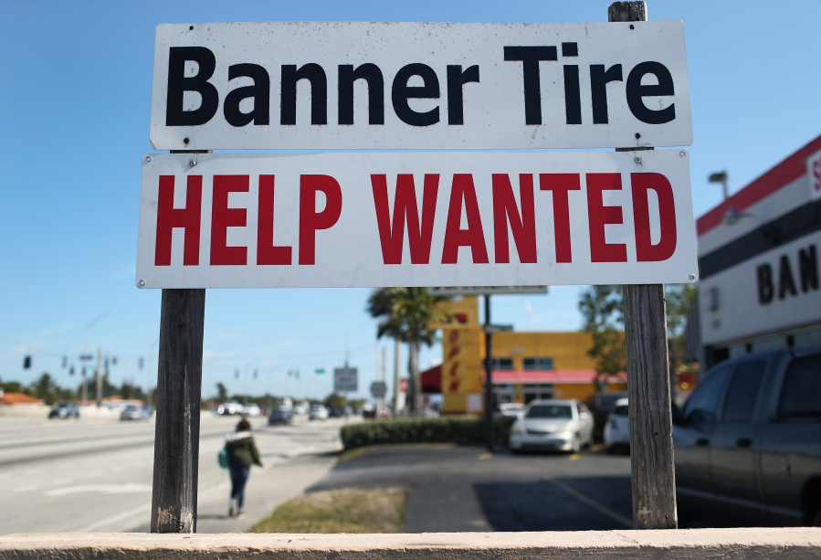 A "Help Wanted" sign is posted in front of a business on February 4, 2021 in Miami.