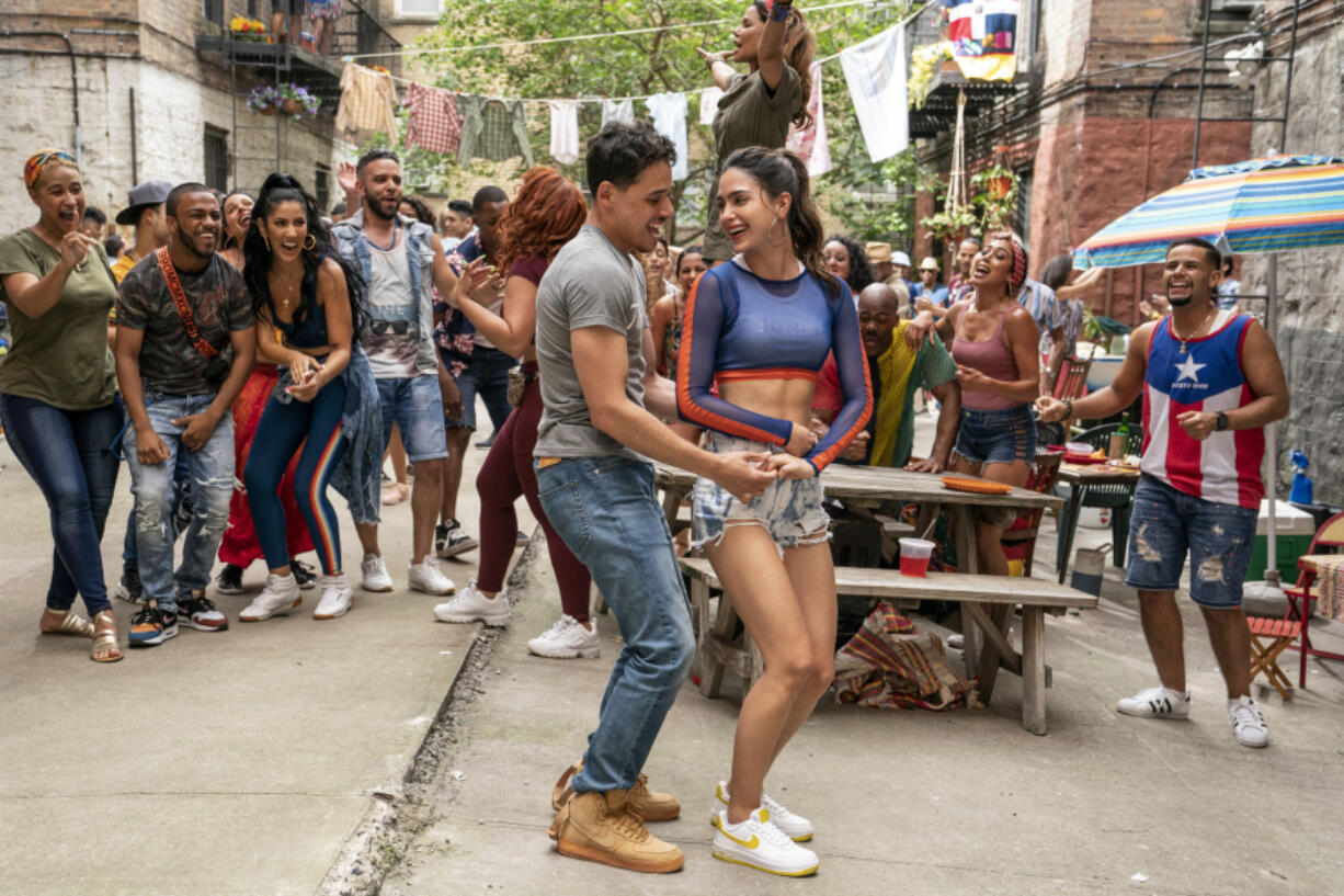 Anthony Ramos, left, and Melissa Barrera in Jon M. Chu???s ???In the Heights," based on Lin-Manuel Miranda's hit Broadway musical.