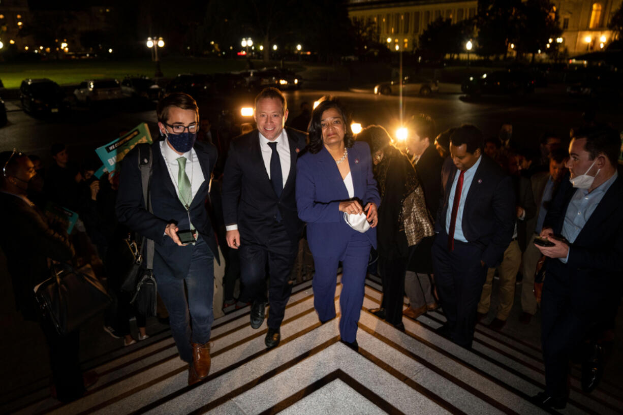 Rep. Josh Gottheimer (D-NJ) and Rep. Pramila Jayapal (D-WA) leave a news conference on the steps of the House of Representatives on Friday, Nov. 5, 2021 in Washington, DC.