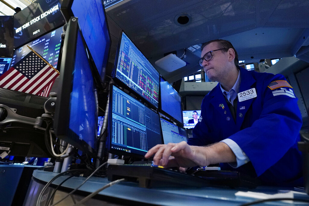 Specialist Patrick King works at his post on the floor of the New York Stock Exchange, Friday, Nov. 19, 2021. Stocks are off to a mostly lower start on Wall Street Friday, though gains for some big technology companies are sending the Nasdaq a bit higher.