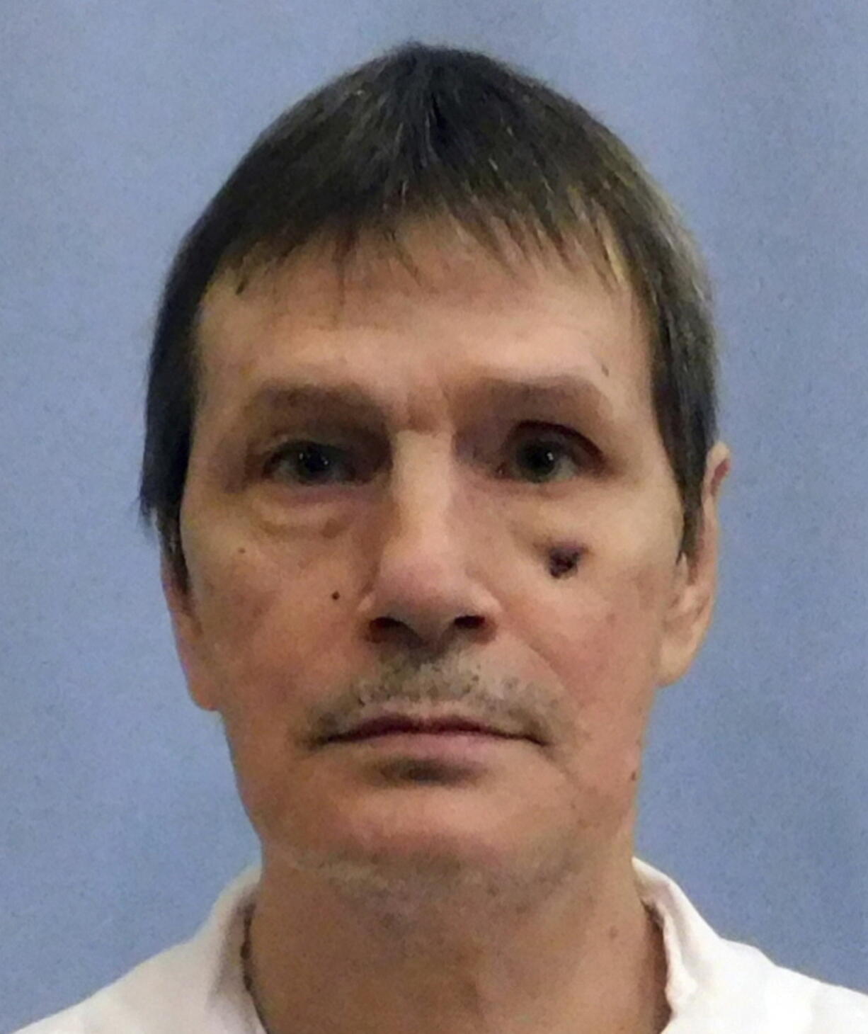 FILE - This undated photo from the Alabama Department of Corrections shows inmate Doyle Lee Hamm. The Alabama inmate whose lethal injection was halted because medical staff couldn't find a suitable vein for the execution has died of natural causes almost four years later, his lawyer said. Hamm, who was convicted in the slaying of a motel clerk in 1987, died of natural causes on death row on Sunday, Nov. 29, 2021 longtime attorney Bernard Harcourt said in an blog post. He was 64.