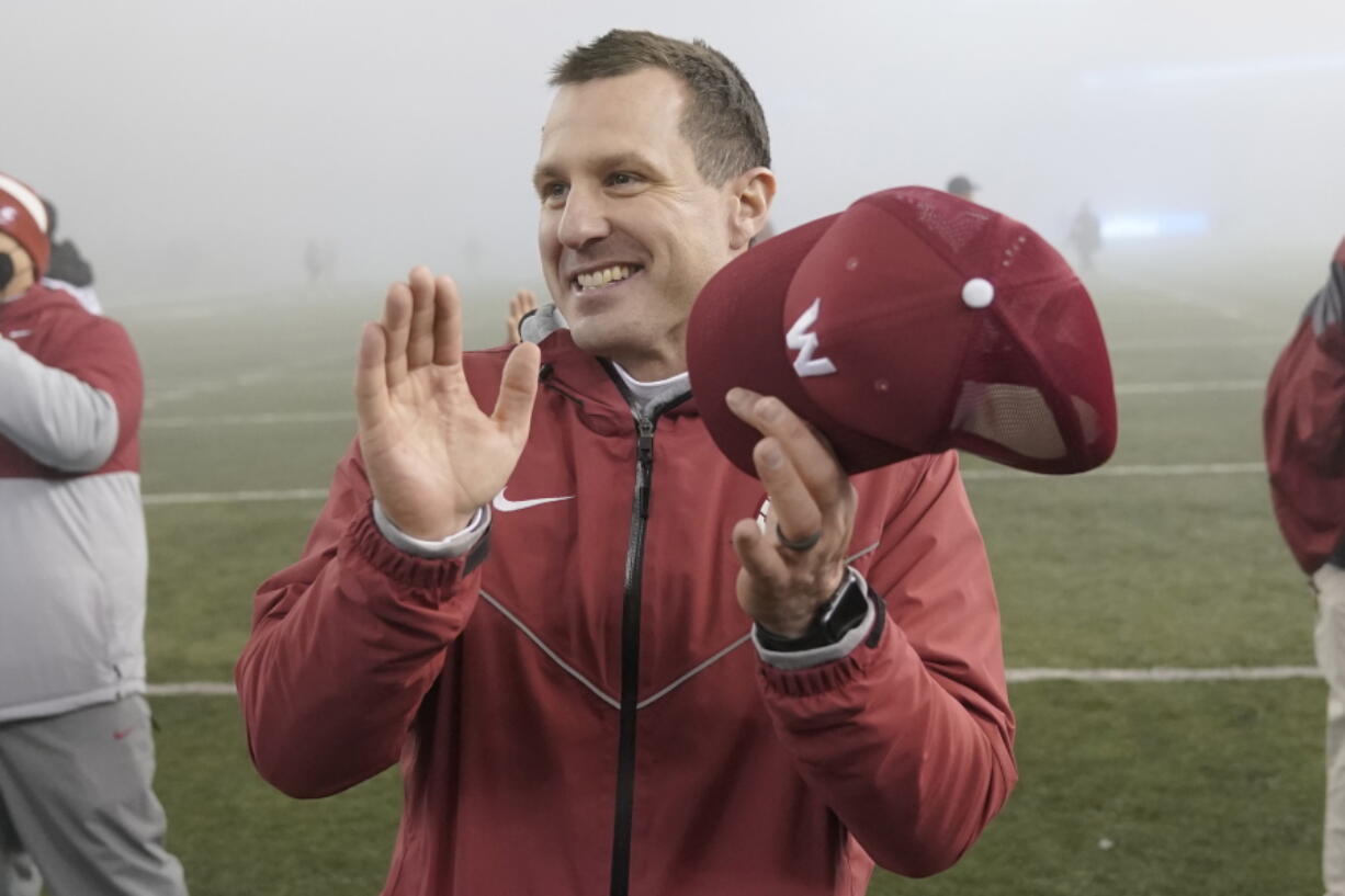 Washington State acting head coach Jake Dickert reacts after a win over Arizona in an NCAA college football game, Friday, Nov. 19, 2021, in Pullman, Wash. Washington State won 44-18 and became bowl eligible. (AP Photo/Ted S.