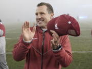 Washington State acting head coach Jake Dickert reacts after a win over Arizona in an NCAA college football game, Friday, Nov. 19, 2021, in Pullman, Wash. Washington State won 44-18 and became bowl eligible. (AP Photo/Ted S.