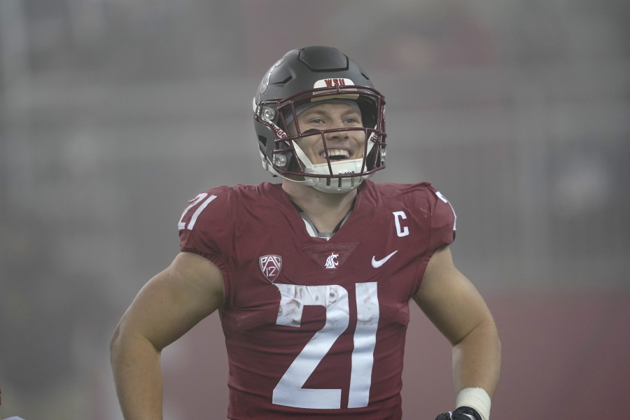 Washington State wide running back Max Borghi (21) reacts late in the second half of an NCAA college football game against Arizona, Friday, Nov. 19, 2021, in Pullman, Wash. Washington State won 44-18. (AP Photo/Ted S.
