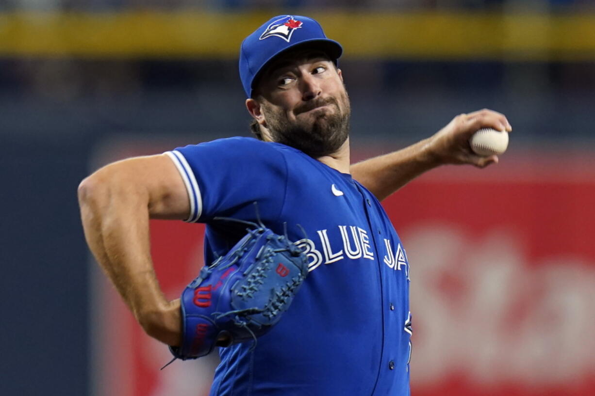 Toronto Blue Jays' Robbie Ray won the AL Cy Young Award on Wednesday, Nov. 17, 2021, bouncing back from taking a rare pay cut after a dismal season to capture pitching's top prize. Ray became the first Toronto pitcher to earn the honor since the late Roy Halladay in 2003.
