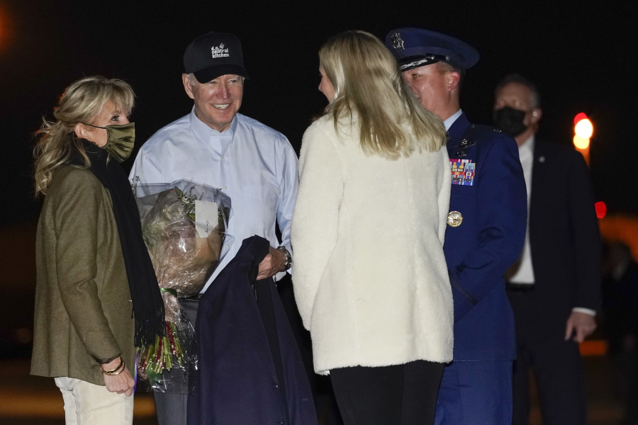 President Joe Biden and first lady Jill Biden are greeted before boarding Air Force one at Andrews Air Force Base, Md., Tuesday, Nov. 23, 2021, en route to Nantucket, Mass.
