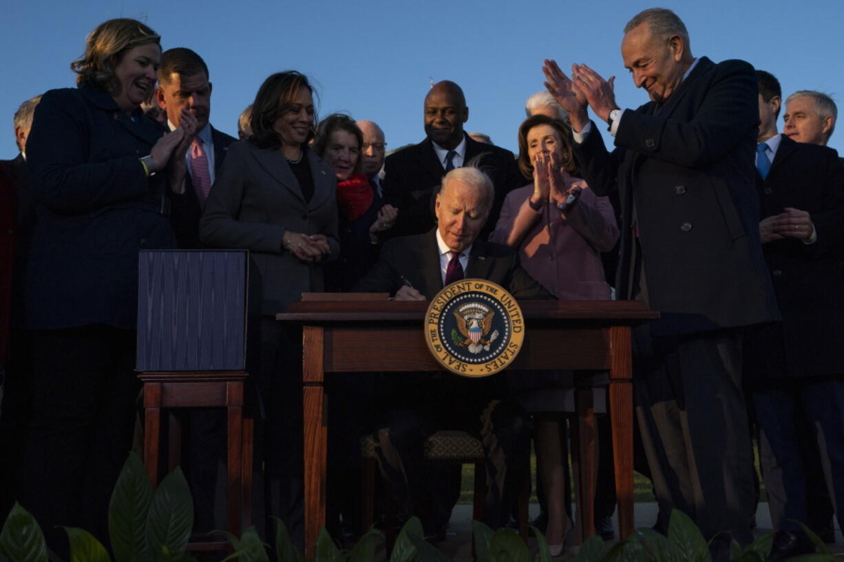 FILE - President Joe Biden signs the "Infrastructure Investment and Jobs Act" during an event on the South Lawn of the White House, Nov. 15, 2021, in Washington. Some Democrats have begun saying out loud what others are saying privately, that Biden's political standing is so weak less than a year into his presidency that he may not be able to win reelection in 2024.