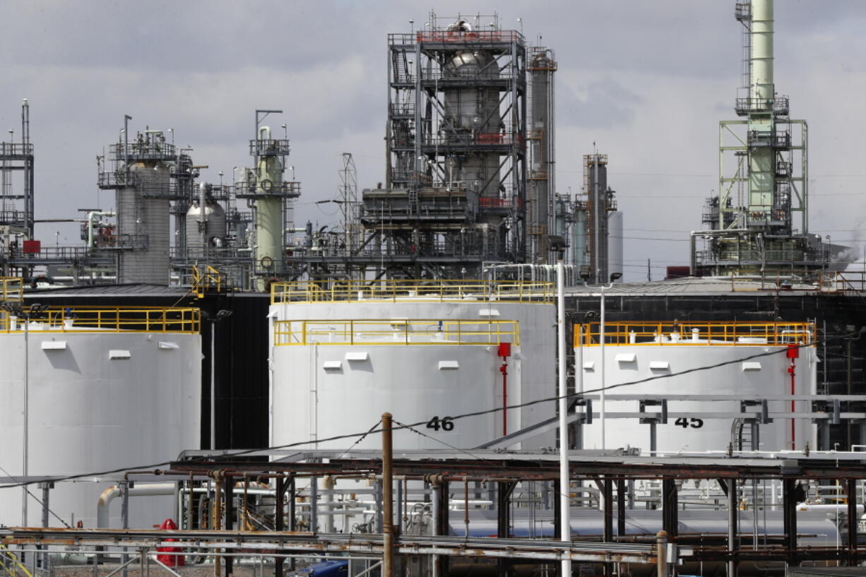 FILE - Storage tanks are shown at a refinery in Detroit, Tuesday, April 21, 2020. The White House on Tuesday said it had ordered 50 million barrels of oil released from strategic reserve to bring down energy costs.