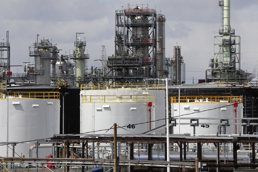 FILE - Storage tanks are shown at a refinery in Detroit, Tuesday, April 21, 2020. The White House on Tuesday said it had ordered 50 million barrels of oil released from strategic reserve to bring down energy costs.