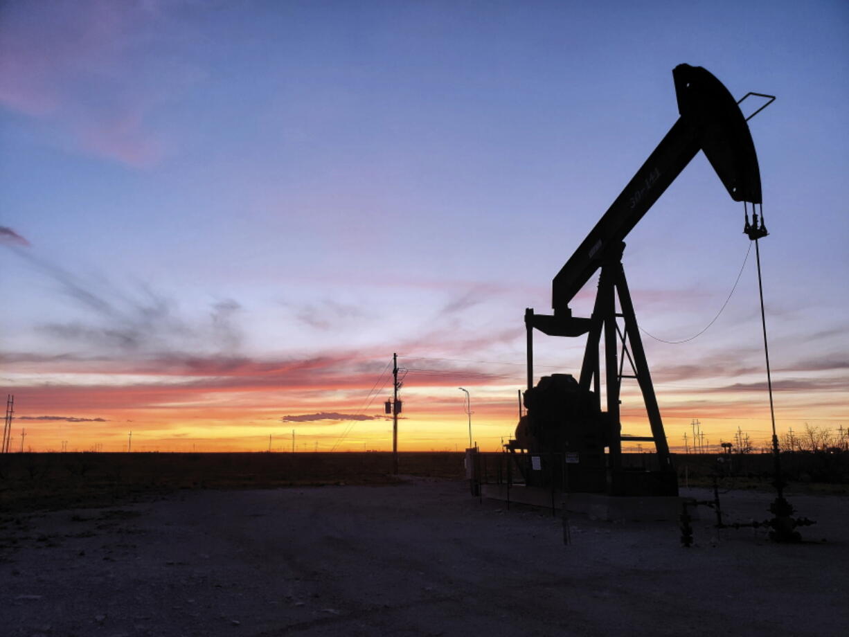 FILE - This April 8, 2020, file photo, shows a pump jack near Hobbs, N.M. The Biden administration is planning to sell oil and gas leases on huge tracts of public land in the U.S. West in coming months.