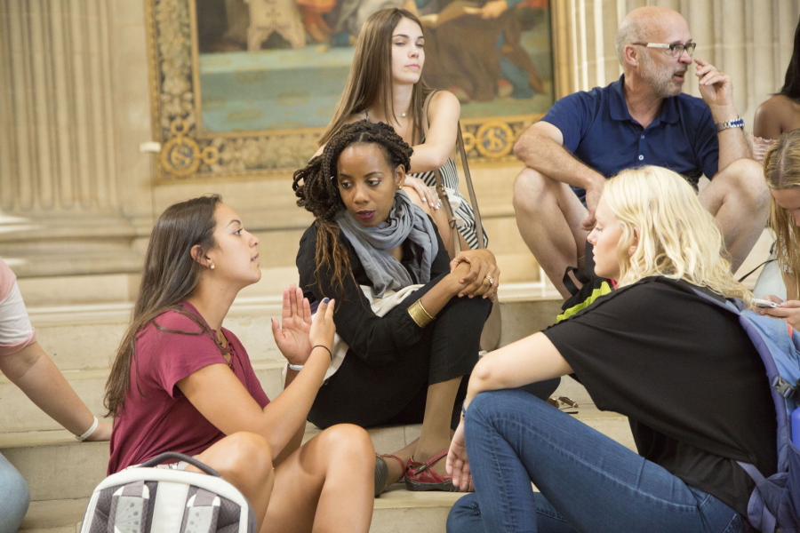 In this photo provided by Centenary College of Louisiana, associate professor Andia Augustin-Billy listens to a student inside the Pantheon in Paris on Aug. 11, 2018, while teaching as part of Centenary College's Centenary in Paris program for first-year students. At 196 years Louisiana's oldest college, Centenary plans a gathering Thursday, Nov. 4, 2021, to honor Augustin-Billy as the first Black person to gain tenure at the school.