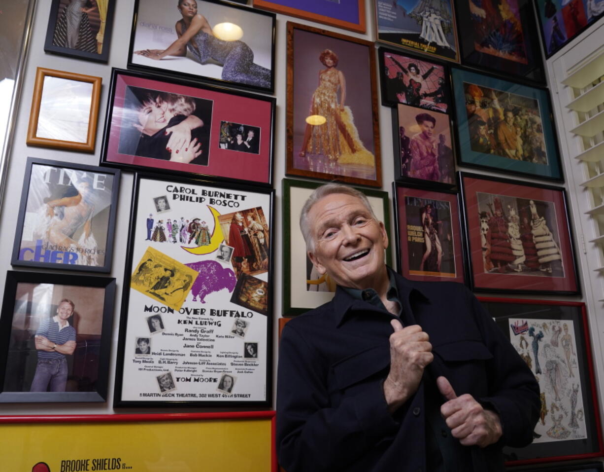 Costume and fashion designer Bob Mackie stands Oct. 20 among memorabilia from his career at his home in Palm Springs, Calif. A new book, "The Art of Bob Mackie," spans the 60-year career of the Oscar and Emmy Award winning designer.