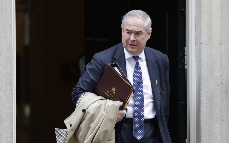 FILE - Britain's Attorney General Geoffrey Cox leaves after attending a cabinet meeting at Downing Street in London, Thursday, Oct. 3, 2019. A British lawmaker defended his 400,000 pound a year ($540,000) second job on Wednesday, Nov. 10, 2021 as calls grew for a crackdown on politicians earning outside income. Conservative legislator Geoffrey Cox, a former U.K. attorney general, said his work as a lawyer did not take him away from representing constituents in the southwest England district he represents in Parliament.