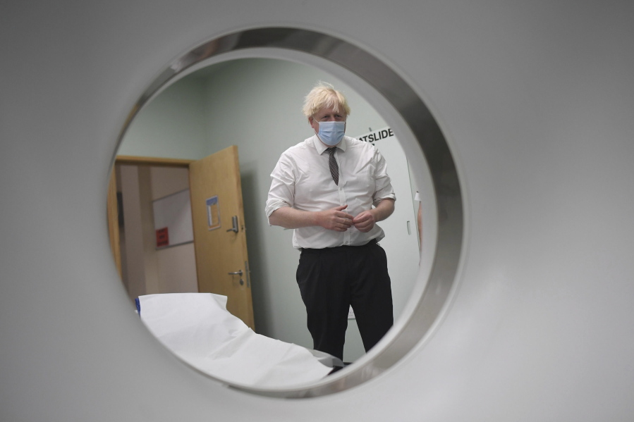 Britain's Prime Minister Boris Johnson is shown around a CT scan room during a visit to Hexham General Hospital in Northumberland, England, Monday, Nov. 8, 2021.