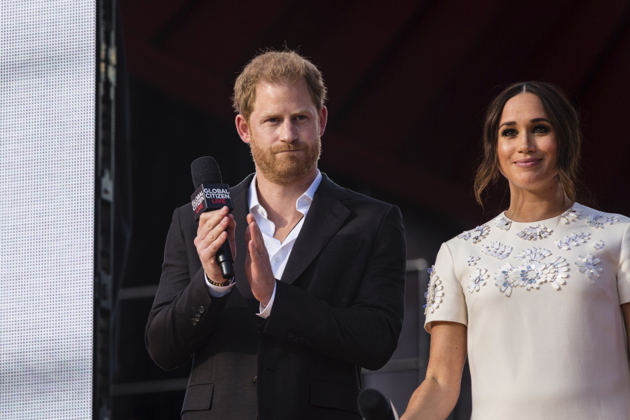 FILE - Prince Harry and Meghan Markle speak during the Global Citizen festival, Sept. 25, 2021 in New York. Britain's Prince Harry says he warned the chief executive of Twitter ahead of the Jan. 6 Capitol riots that the social media site was being used to stage political unrest in the U.S. capital. Harry made the comments Tuesday, Nov. 9 during a panel on misinformation in California.