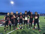 Central Washington football players from Clark County, from left, Tyler Flanagan (Woodland), Jude Mullette (Mountain View), Dylan Dean (Columbia River), Max Randle (Battle Ground), Will Ortner (Hockinson), Kai Gamble (Union), Isaiah Carbajal (Mountain View) hoisting the GNAC trophy.