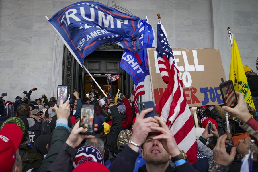 FILE - In this Jan. 6, 2021, photo, insurrections loyal to President Donald Trump riot outside the Capitol in Washington. Trump's lawyers on Tuesday will try to persuade a federal appeals court to stop Congress from receiving call logs, drafts of speeches and other documents related to the Jan. 6 insurrection led by his supporters.