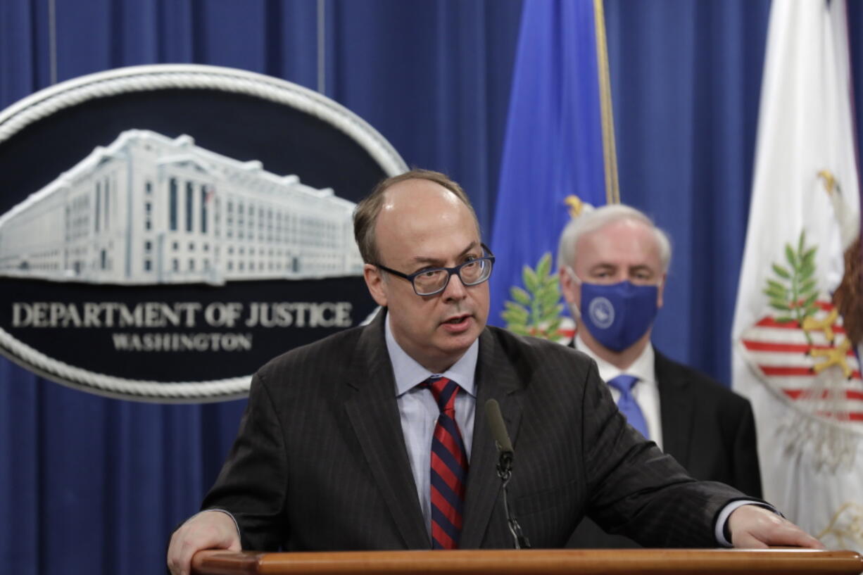 FILE - Acting Assistant U.S. Attorney General Jeffrey Clark speaks as he stands next to Deputy Attorney General Jeffrey A. Rosen during a news conference at the Justice Department in Washington, Oct. 21, 2020. Clark, who aligned himself with former President Donald Trump after he lost the 2020 election has declined to be fully interviewed by a House committee investigating the Jan. 6 Capitol insurrection, ending a deposition after around 90 minutes on Friday, Nov. 5.