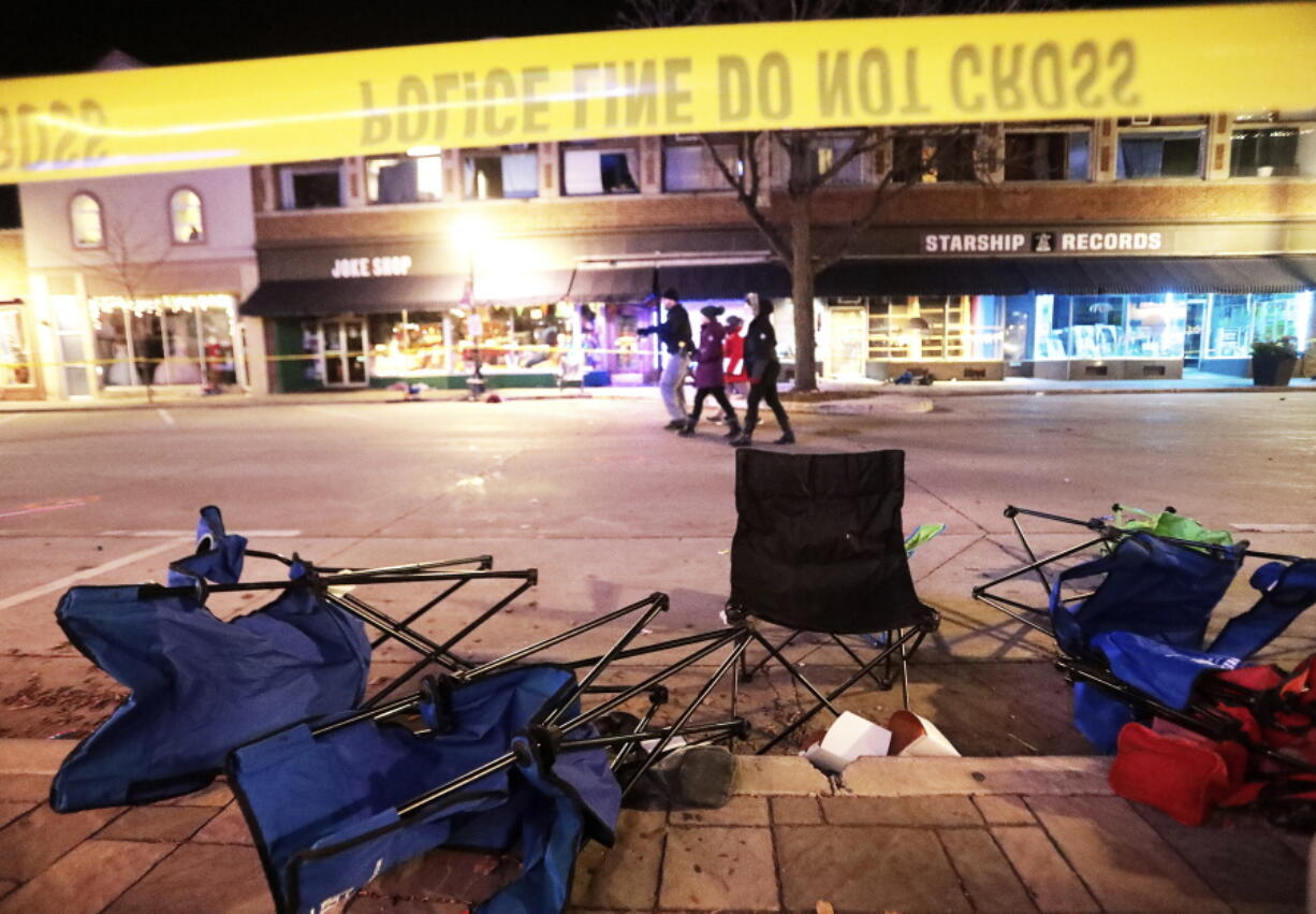 Toppled chairs line W. Main St. in downtown Waukesha, Wis., after an SUV drove into a parade of Christmas marchers Sunday, Nov. 21, 2021.