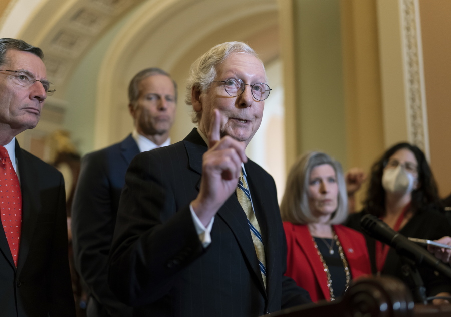 Senate Minority Leader Mitch McConnell, R-Ky., joined from left by Sen. John Barrasso, R-Wyo., and Minority Whip John Thune, R-S.D., speaks to reporters following a GOP strategy meeting, at the Capitol in Washington, Tuesday, Nov. 16, 2021. (AP Photo/J.