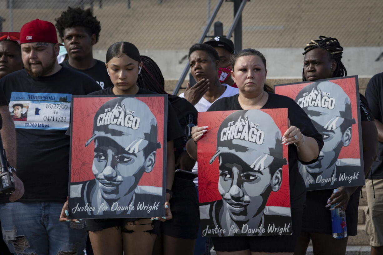 FILE- The family of Daunte Wright attend a rally and march organized by families who were victims of police brutality in in St. Paul, Minn.,Monday, May 24, 2021. The trial for the police officer accused of killing Daunte Wright starts Monday, Nov. 29.