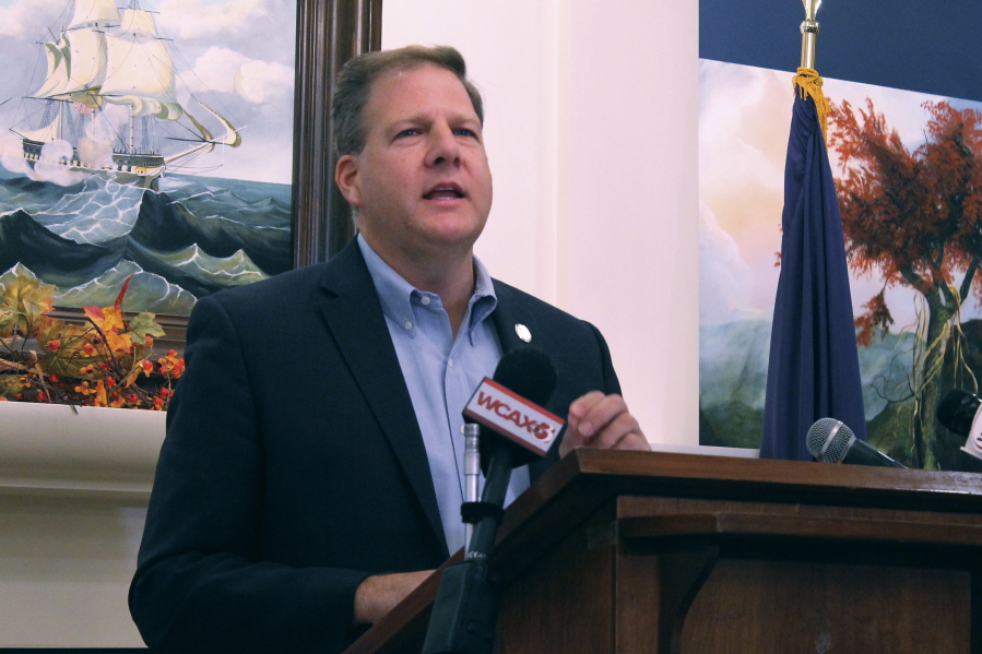 Republican Gov. Chris Sununu announces that he is seeking a fourth term as governor of New Hampshire, instead of running for the U.S. Senate seat held by Democratic Sen. Maggie Hassan, during a news conference, Tuesday, Nov. 9, 2021, in Concord, N.H.