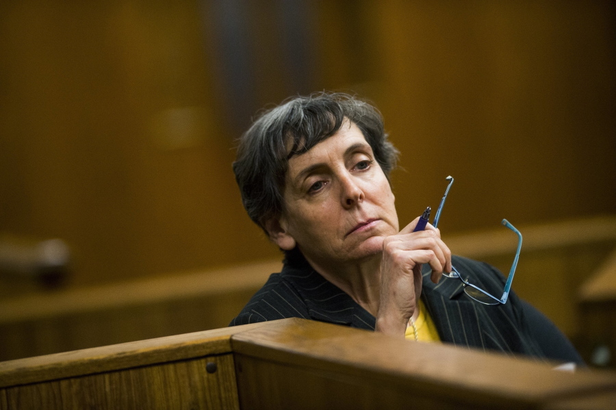 FILE-  Defendant Liane Shekter Smith listens during a preliminary examination in the cases of four defendants, all former or current officials from the Michigan Department of Environmental Quality, in Flint, Mich on Feb. 5, 2018. The state of Michigan said Friday, Nov. 5, 2021, it agreed to pay $300,000 to the only employee who was fired as a result of lead-contaminated water in Flint. The agreement with Liane Shekter Smith, who was head of the state's drinking water division, came weeks after an arbitrator said she was wrongly fired in 2016 by officials who were likely looking for a "public scapegoat" in one of the worst environmental disasters in U.S. history.