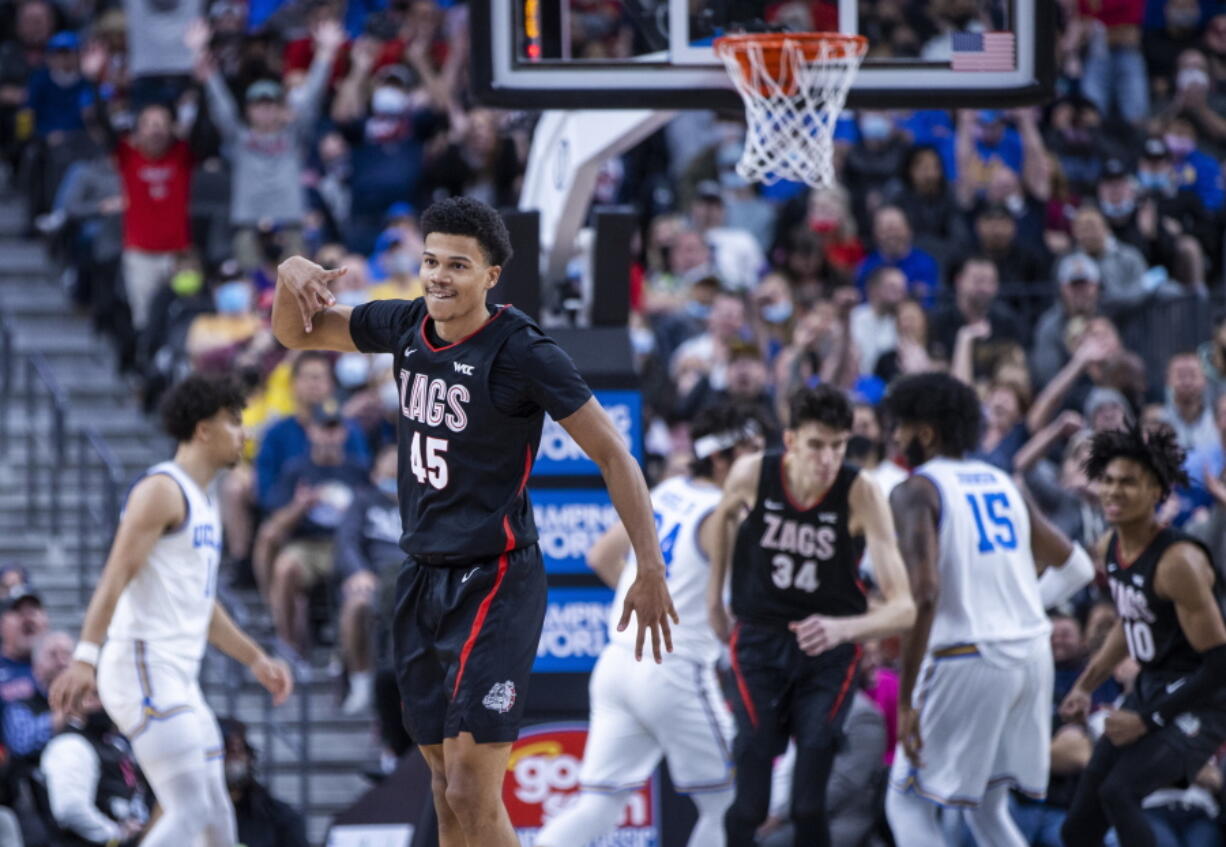Gonzaga guard Rasir Bolton (45) celebrates a 3-point basket against UCLA during the first half of an NCAA college basketball game Tuesday, Nov. 23, 2021, in Las Vegas. (AP Photo/L.E.
