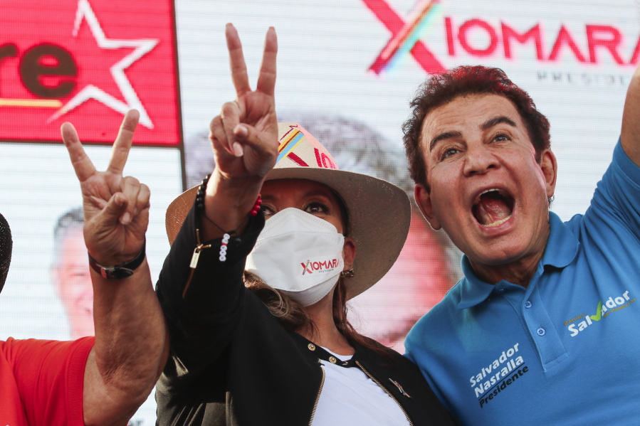 Free Party presidential candidate Xiomara Castro acknowledges supporters accompanied by her running mate Salvador Nasralla, right, during a closing campaign rally, in San Pedro Sula, Honduras, Saturday, Nov. 20, 2021. Honduras will hold presidential election on Nov. 28.