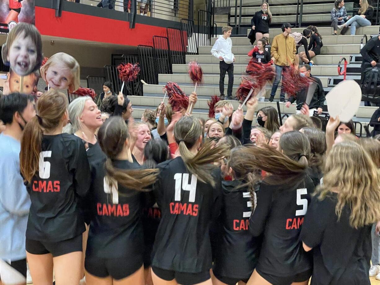 Camas players celebrate with the Papermakers’ student section after securing a 3-0 win over Kelso on senior night.