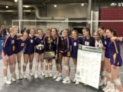 The Columbia River volleyball team shows off their prizes after winning the Class 2A state championship in four sets over Ridgefield on Saturday in Yakima.