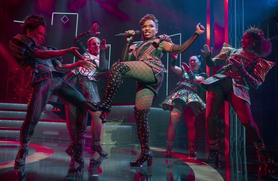 Brittney Mack portrays Anna of Cleves, center, during a performance of the musical "Six," at Broadway's Brooks Atkinson Theatre in New York. Mack is slated to perform a mashup of some of its songs with her castmates and band in front of a televised audience of millions at the Macy's Thanksgiving Day Parade.