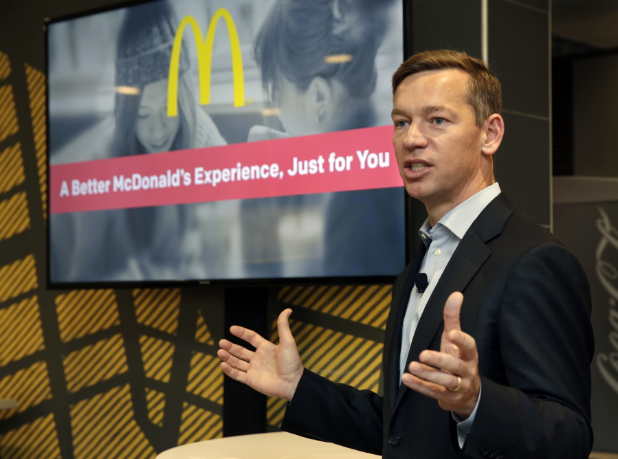 FILE - Chris Kempczinski, then-incoming president of McDonald's USA, speaks during a presentation at a McDonald's restaurant in New York's Tribeca neighborhood, Nov. 17, 2016.  Chris Kempczinski,  the CEO of McDonald's faced increasing criticism Thursday, Nov. 11, 2021 including more calls for resignation, following texts messages he sent to Chicago Mayor Lori Lightfoot where he seemed to blame the deaths of two Black and Latino children killed in gun violence on their parents.
